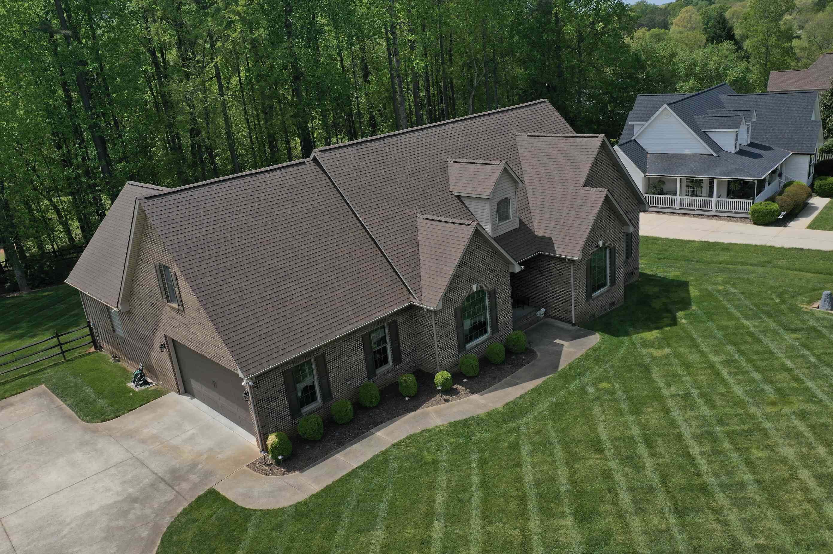 Front view of a Lake Norman, NC home with a new asphalt shingle roof installed by Catawba Valley Roofing.