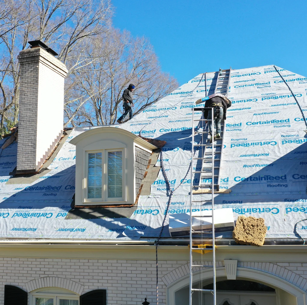 New roof installation using premium asphalt shingles, ensuring a durable and long-lasting roof for your home.