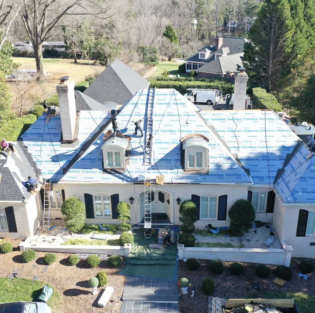 Full roof replacement using new asphalt shingles, offering a modern, durable solution for residential homes.