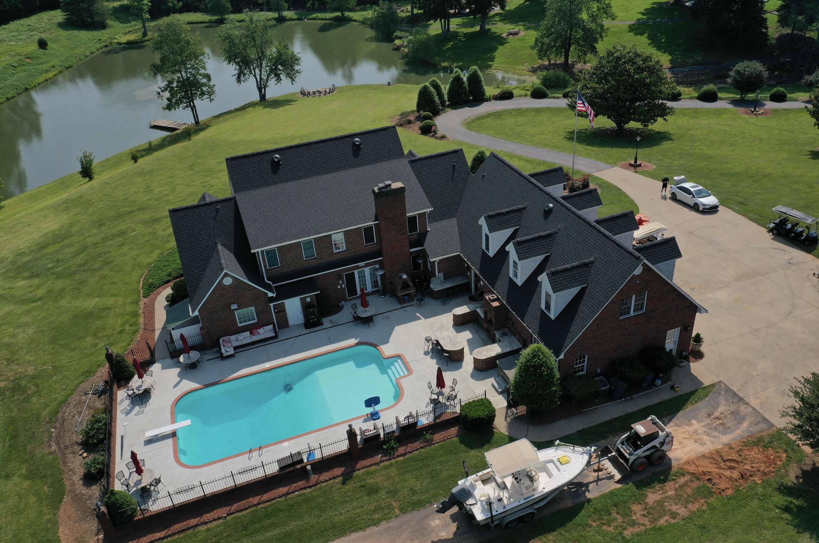 Premium asphalt shingles with precise installation on a farmhouse roof in Hickory NC