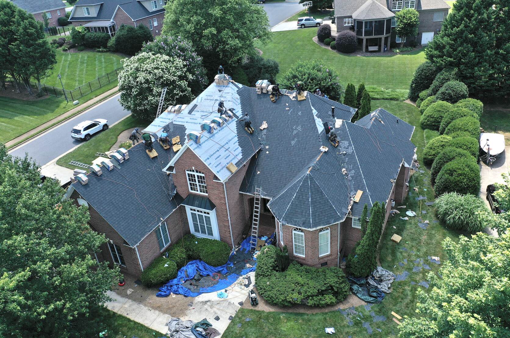 Moores Ferry home getting a new roof in Hickory NC (front view during install)