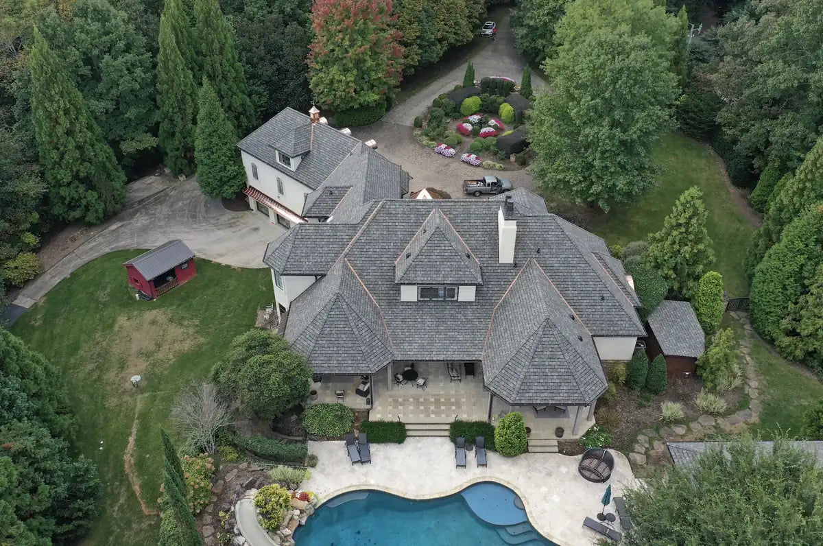 Aerial view of a large Hickory NC home with a new asphalt shingle roof installed by Catawba Valley Roofing & Restoration
