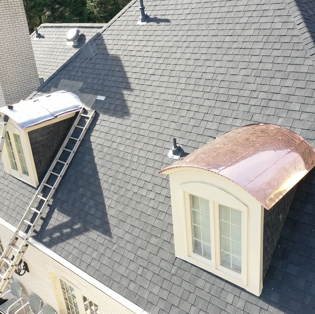 High-end residential roof replacement with premium materials, expertly installed for maximum protection and aesthetic value.