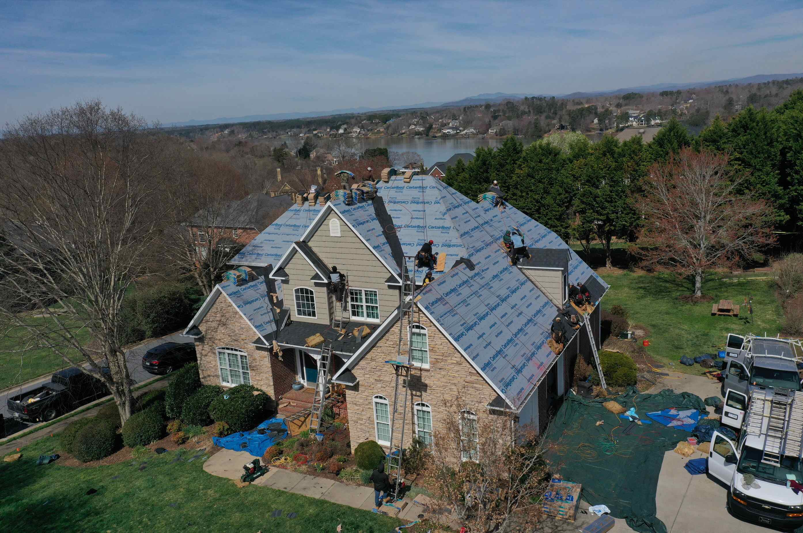 Trusted roofing professionals in Hickory NC completing a detailed asphalt shingle installation for a residential client